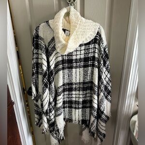 Black and white cowl neck poncho with fringe